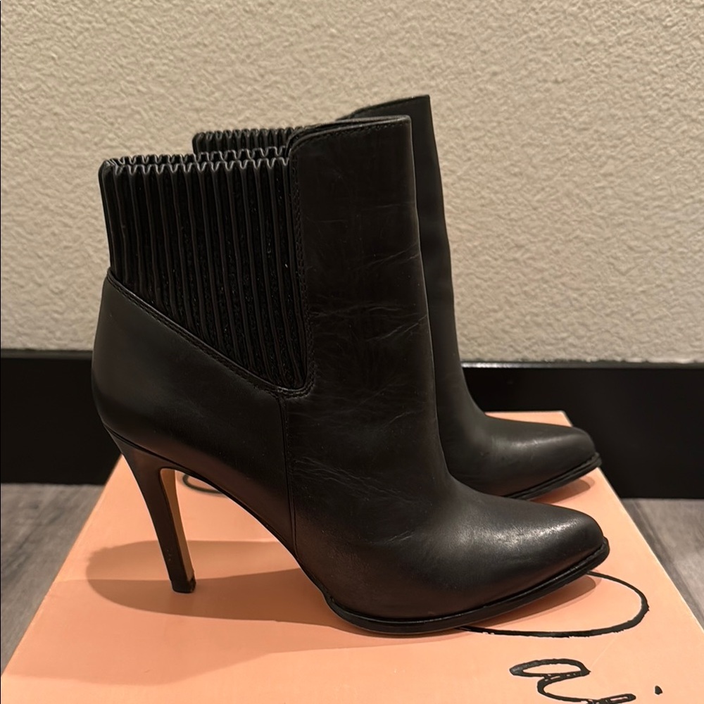 Wild Pair Black Heeled Boots with Stiletto Design